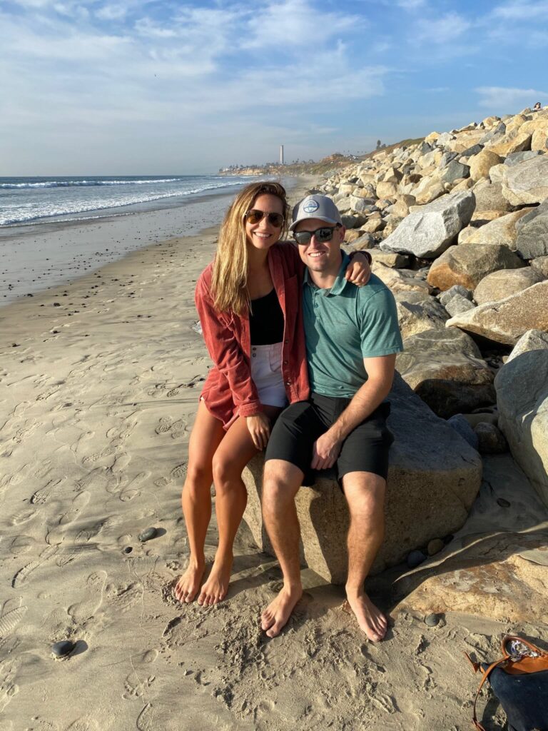 john and his wife on the beach
